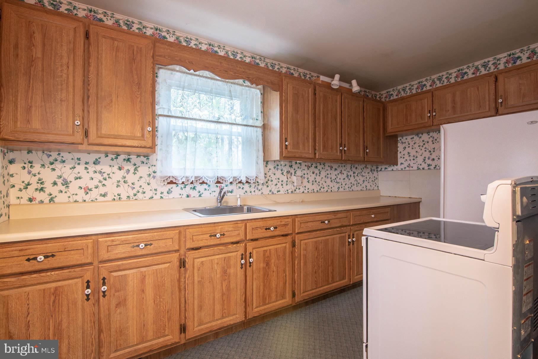 5061 Rippling Run Road Red Lion, PA 17356 - Photo 9 of 44 a kitchen with sink cabinets and window