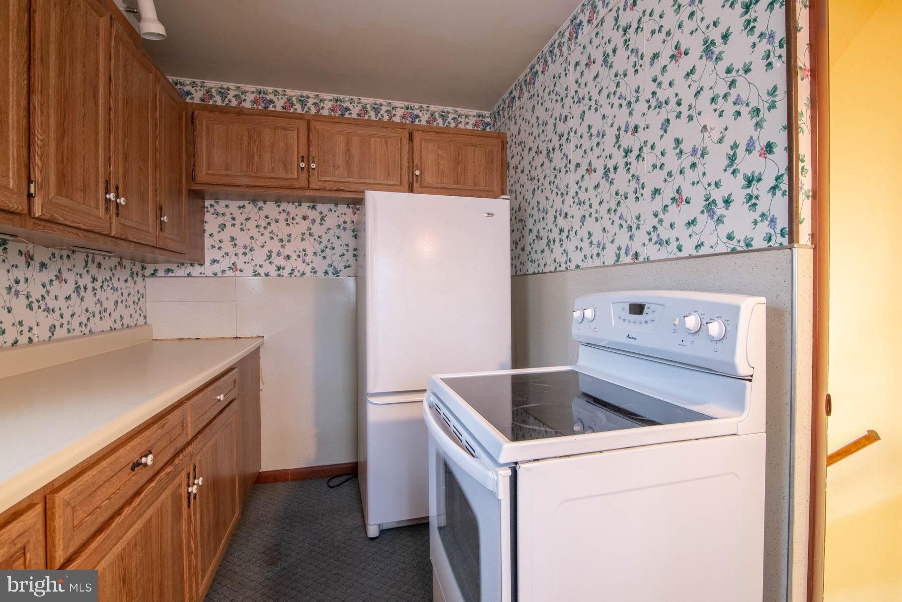 5061 Rippling Run Road Red Lion, PA 17356 - Photo 10 of 44 a kitchen with a sink and cabinets