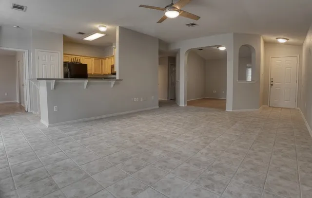 a view of a big room with a kitchen