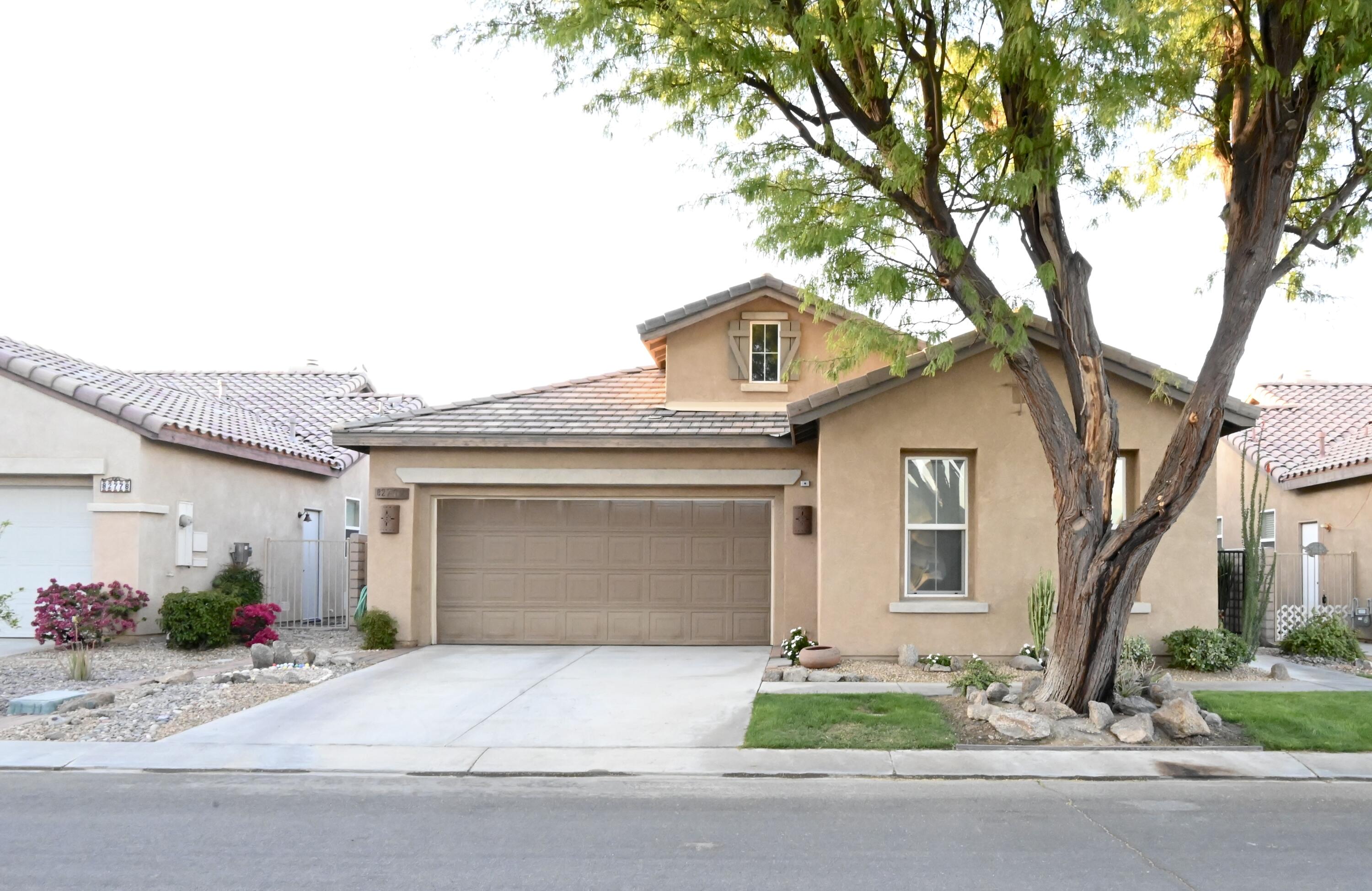 front view of a house with a small yard