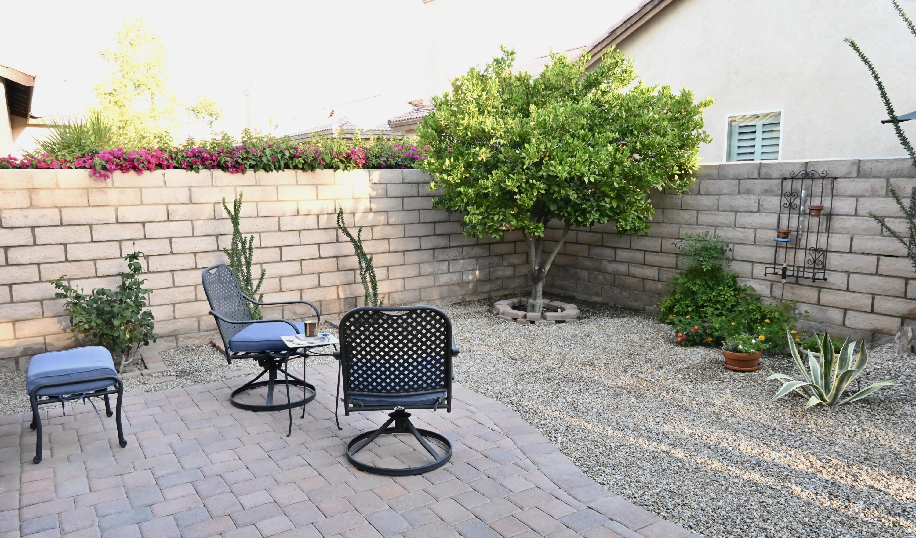 82782 Matthau Drive Indio, CA 92201 - Photo 15 of 27 a backyard of a house with seating space and trees