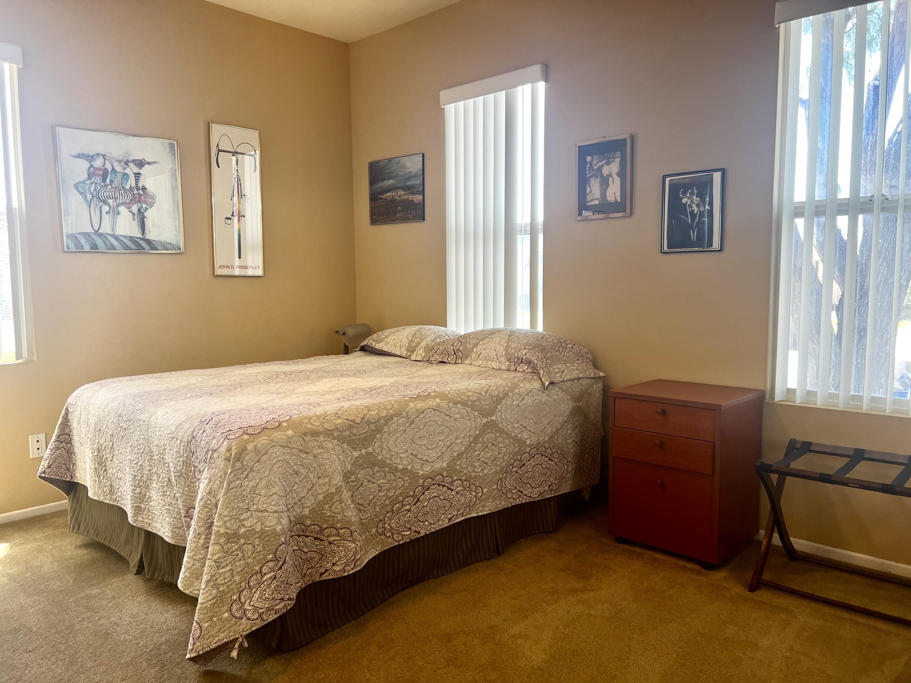 82782 Matthau Drive Indio, CA 92201 - Photo 16 of 27 a bed sitting in a bedroom next to a window