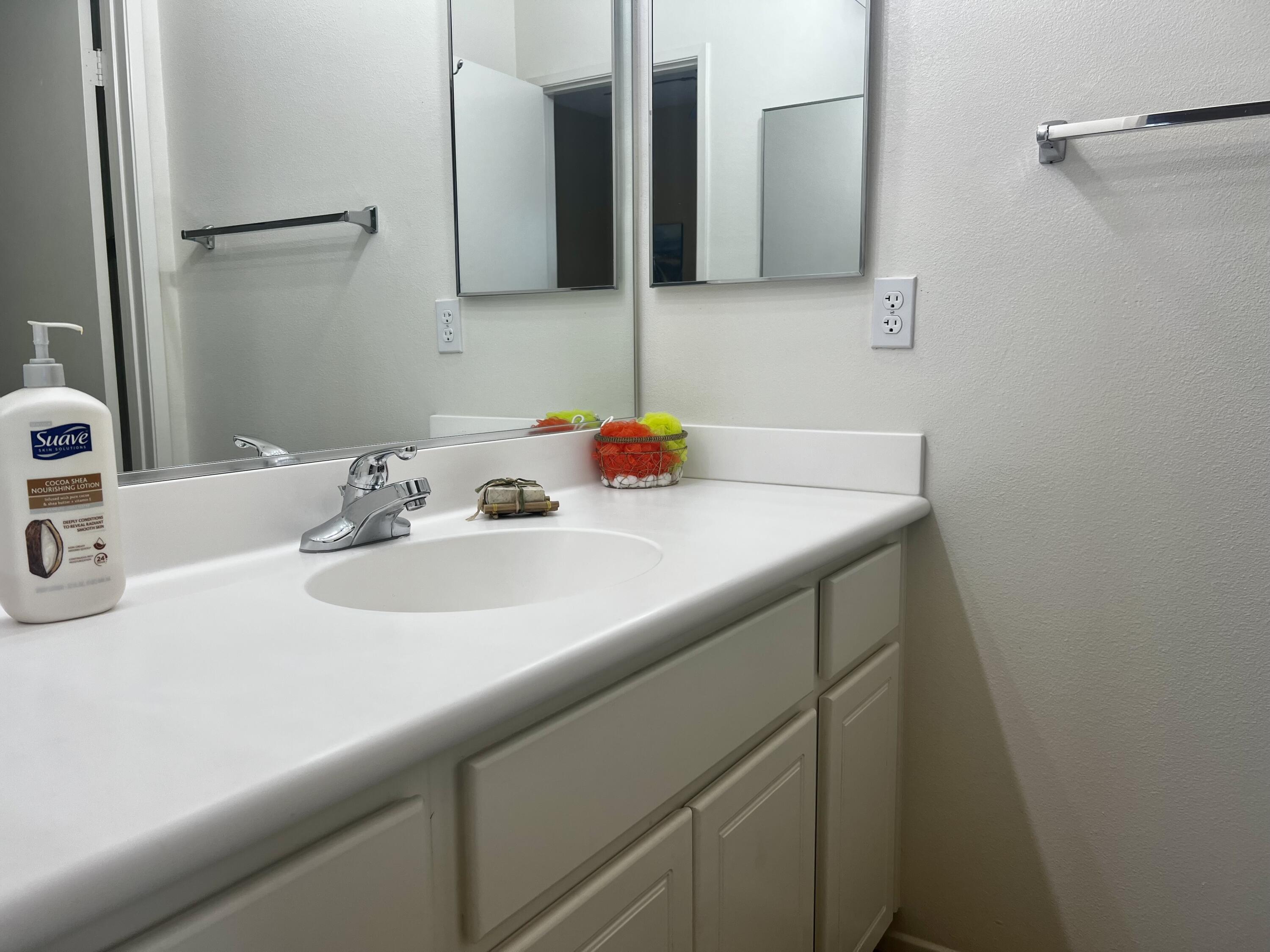 82782 Matthau Drive Indio, CA 92201 - Photo 18 of 27 a bathroom with a sink and a mirror