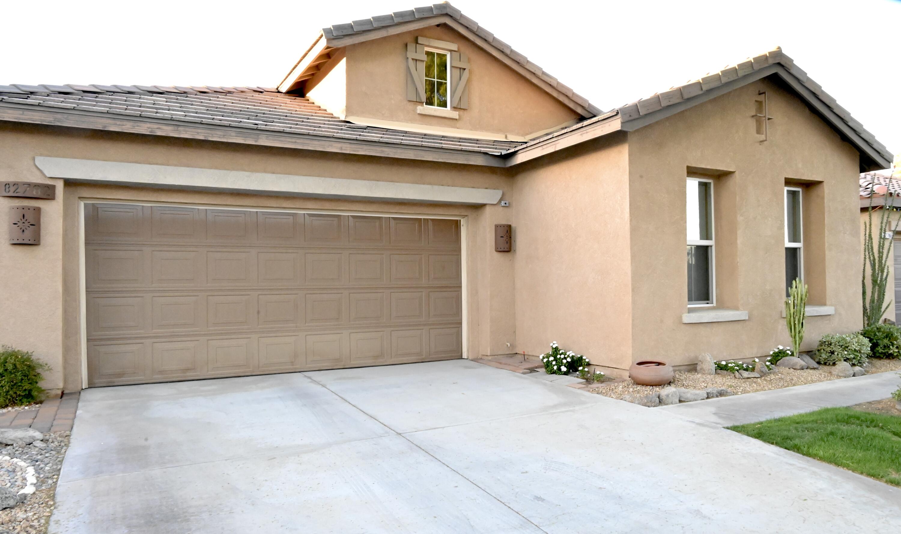 82782 Matthau Drive Indio, CA 92201 - Photo 22 of 27 a front view of a house