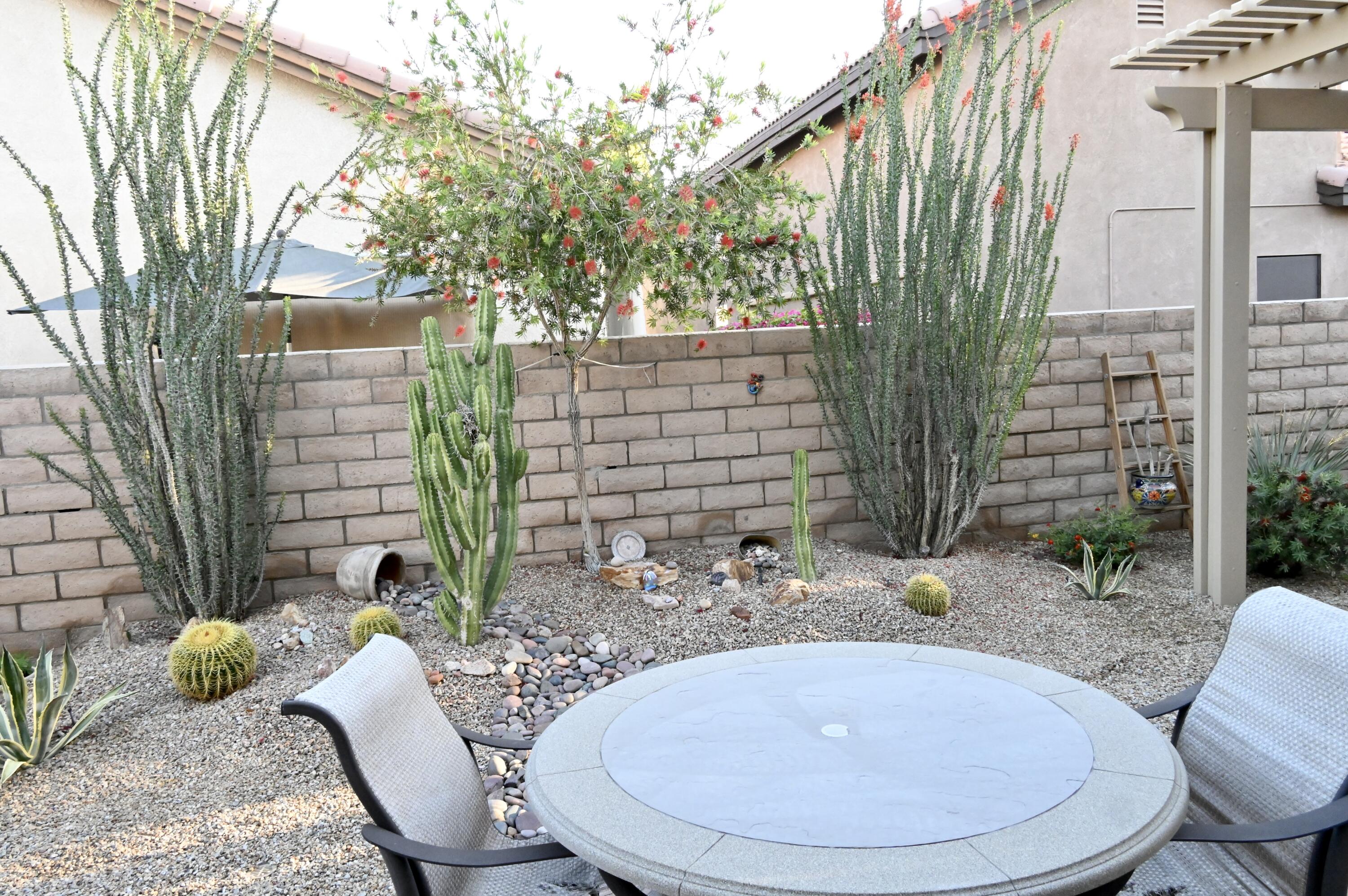 82782 Matthau Drive Indio, CA 92201 - Photo 27 of 27 a backyard of a house with outdoor seating