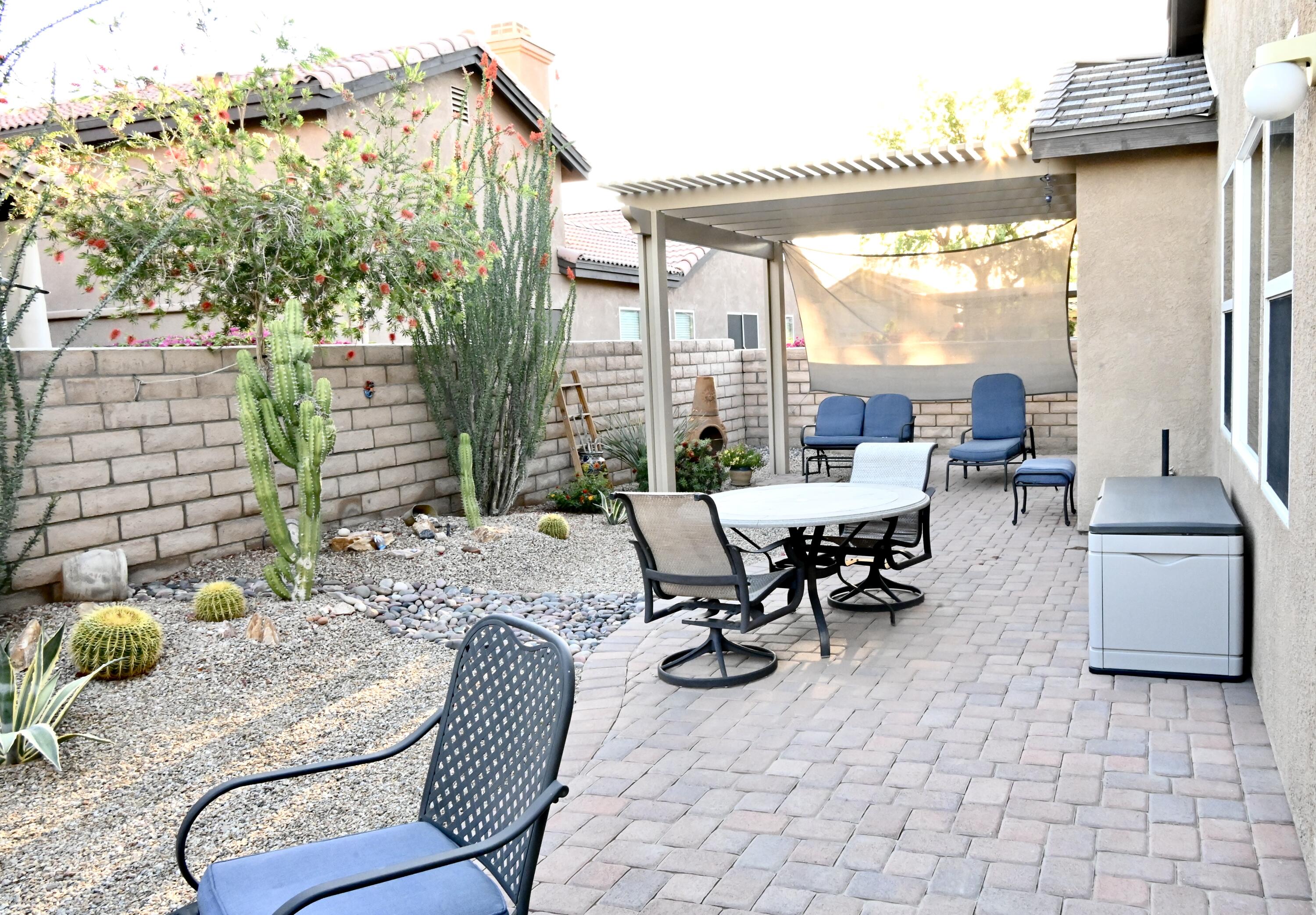 82782 Matthau Drive Indio, CA 92201 - Photo 4 of 27 a view of a patio with table and chairs