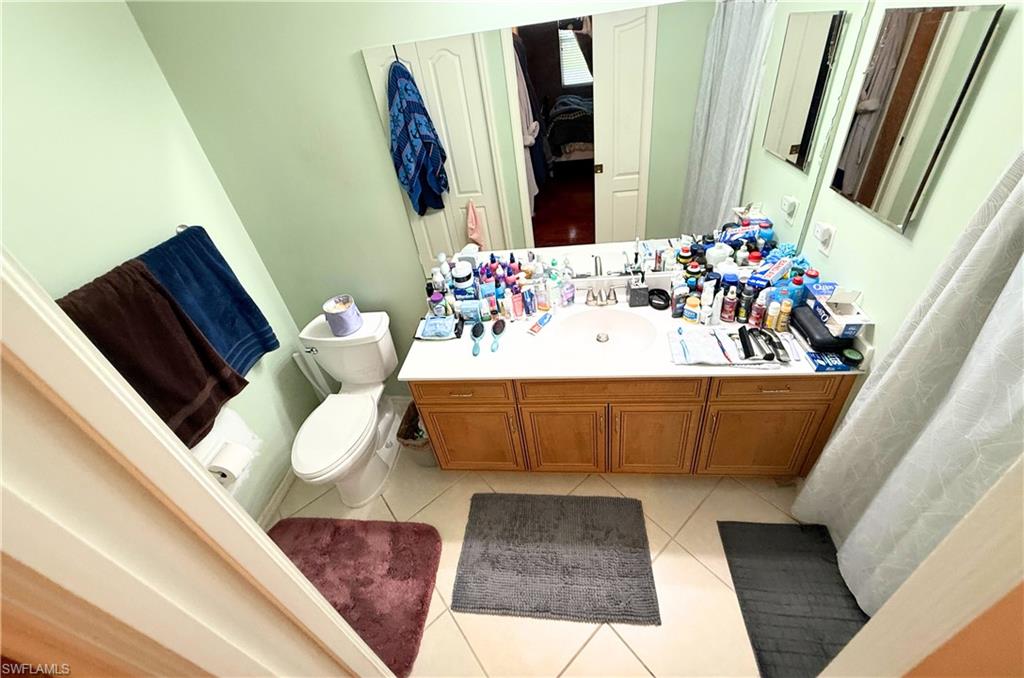 8490 Kingbird Loop, Unit 930 Estero, FL 33967 - Photo 11 of 12 Full bath featuring tile patterned flooring and vanity
