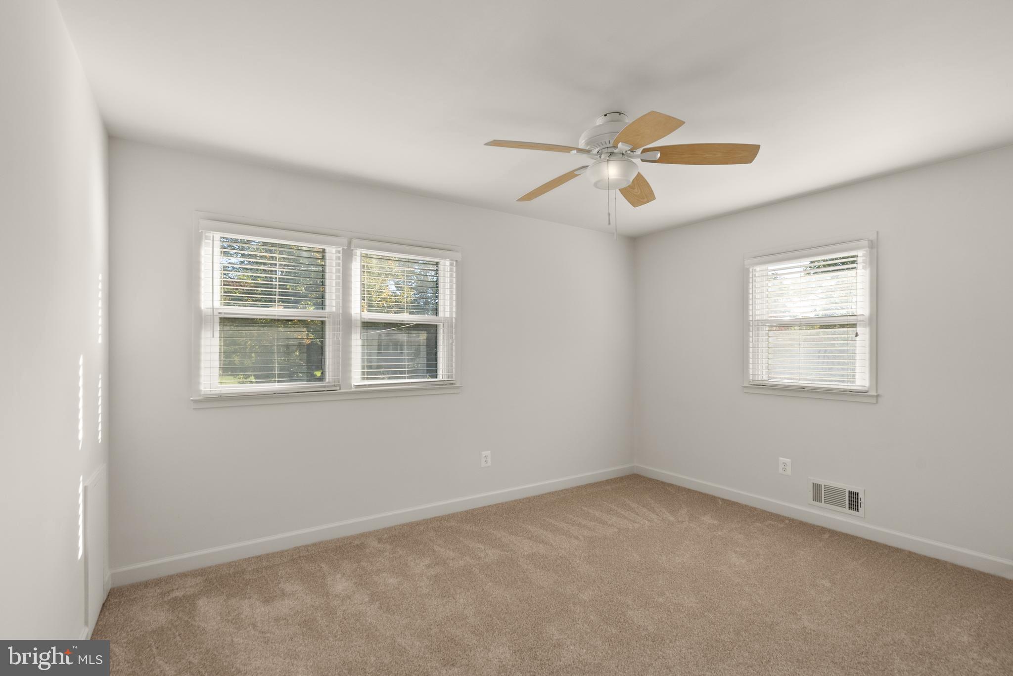 1726 Baldwin Drive McLean, VA 22101 - Photo 23 of 47 an empty room with windows and fan