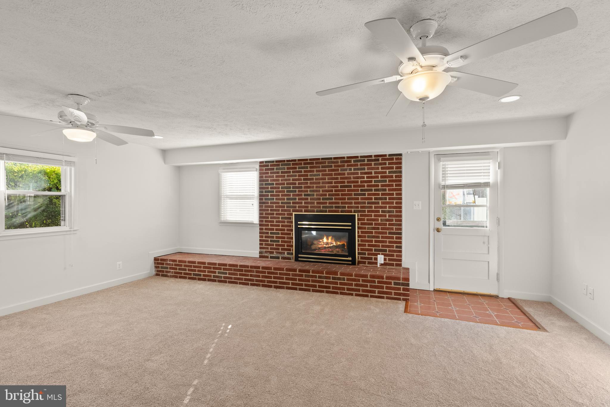 1726 Baldwin Drive McLean, VA 22101 - Photo 27 of 47 an empty room with windows and fireplace