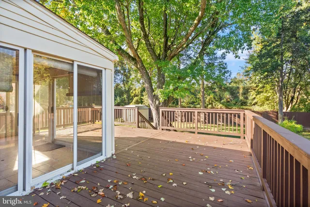 a balcony with trees in front of it