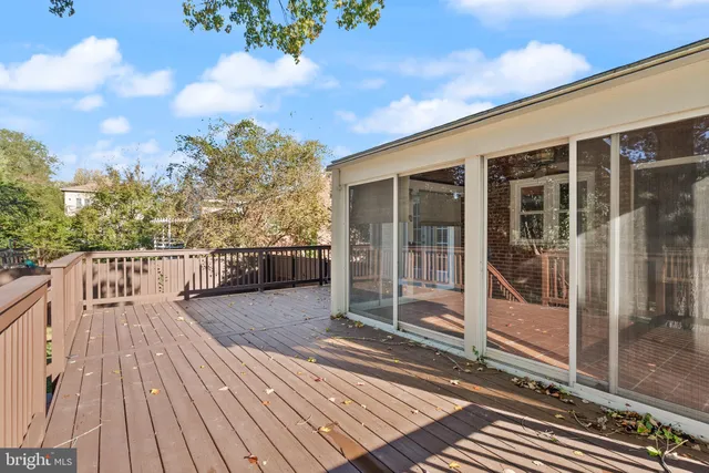 a balcony with wooden floor
