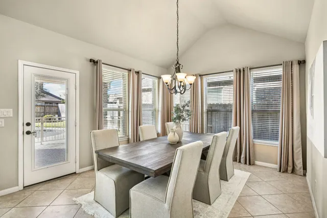 a kitchen with granite countertop kitchen island a sink appliances and cabinets