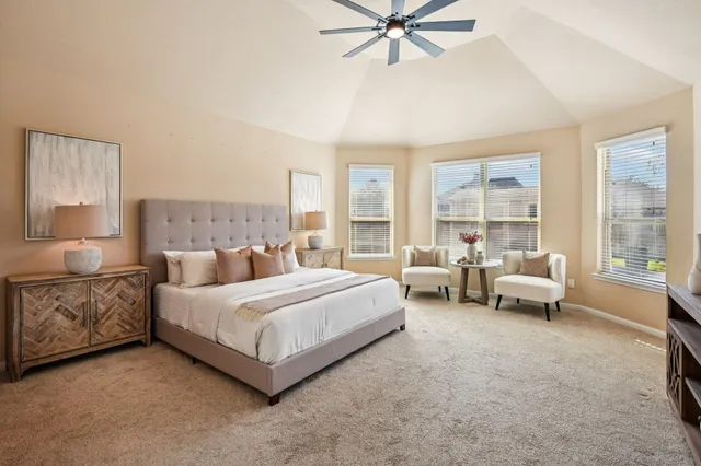 a view of a dining room with furniture wooden floor and chandelier