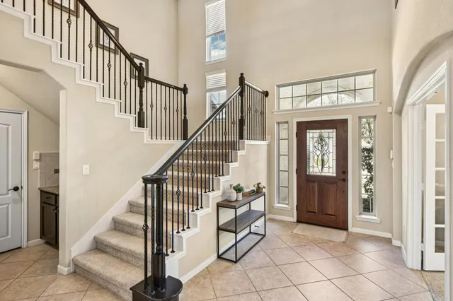 a view of entryway and hall with a front door