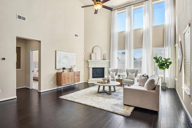 a living room with furniture fireplace and window