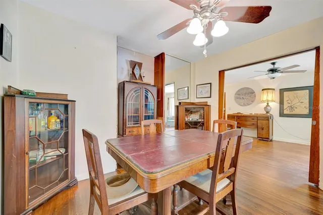 a dining room with furniture and window