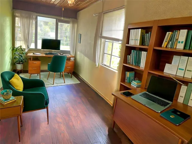 a view of workspace with lounge chair