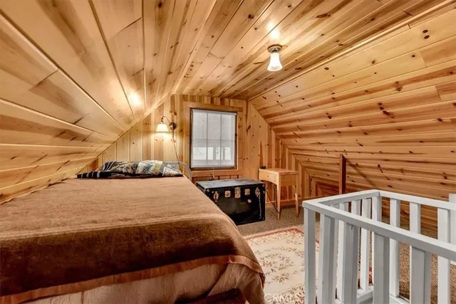 a living room with furniture rug and wooden floor