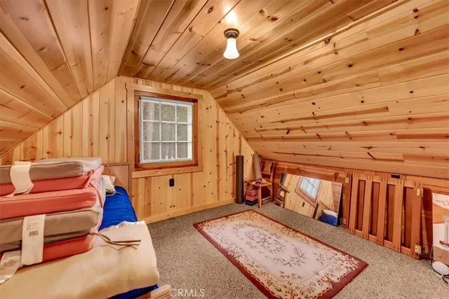 a view of front door with furniture and a window
