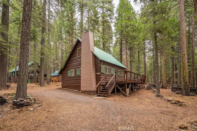 a view of a chairs and tables in the back yard