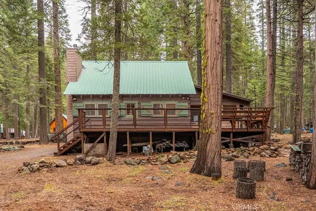 a view of outdoor space with deck and hardwood