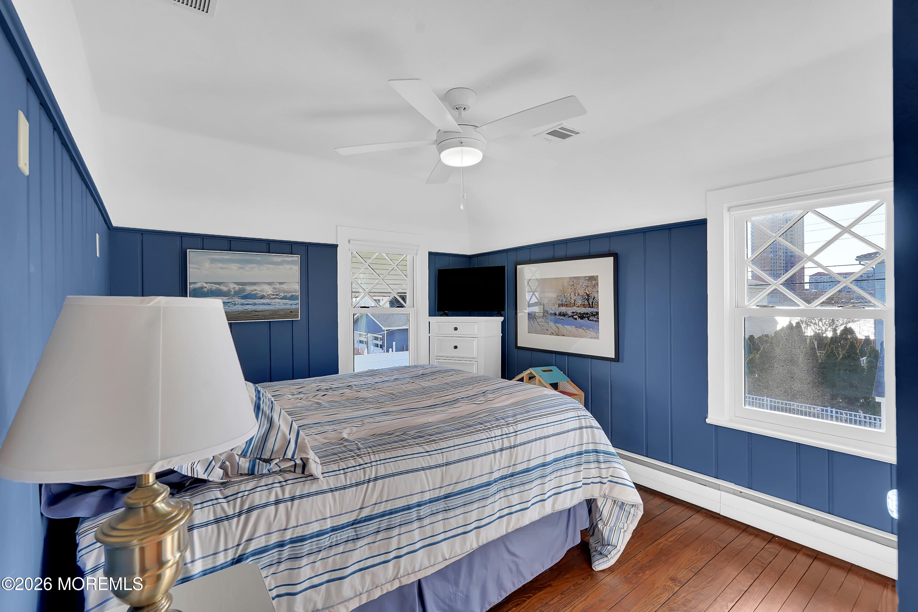 112 Euclid Avenue Allenhurst, NJ 07711 - Photo 15 of 52 a bedroom with a bed and wooden floor