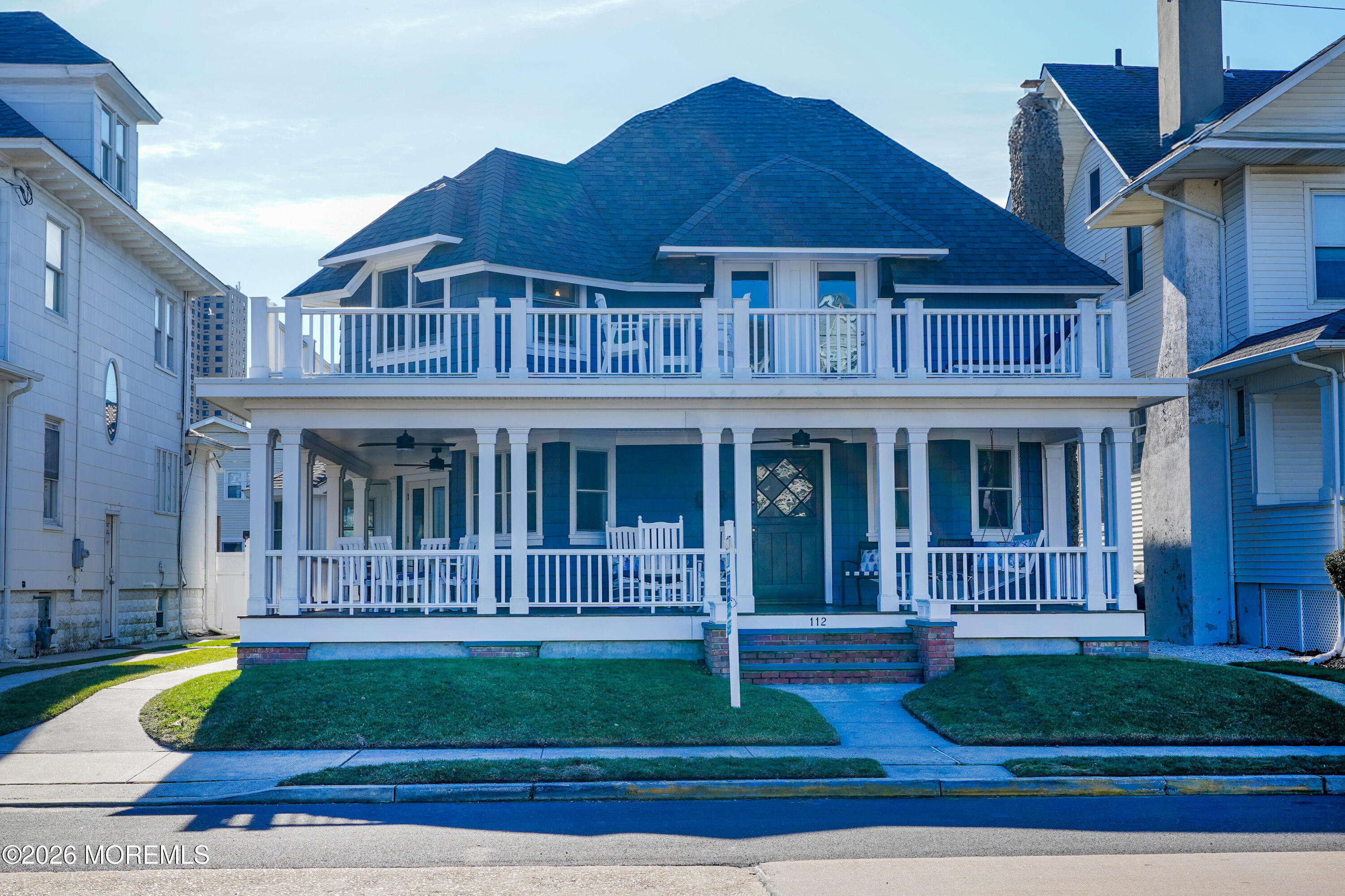 112 Euclid Avenue Allenhurst, NJ 07711 - Photo 2 of 52 a front view of a house with a garden