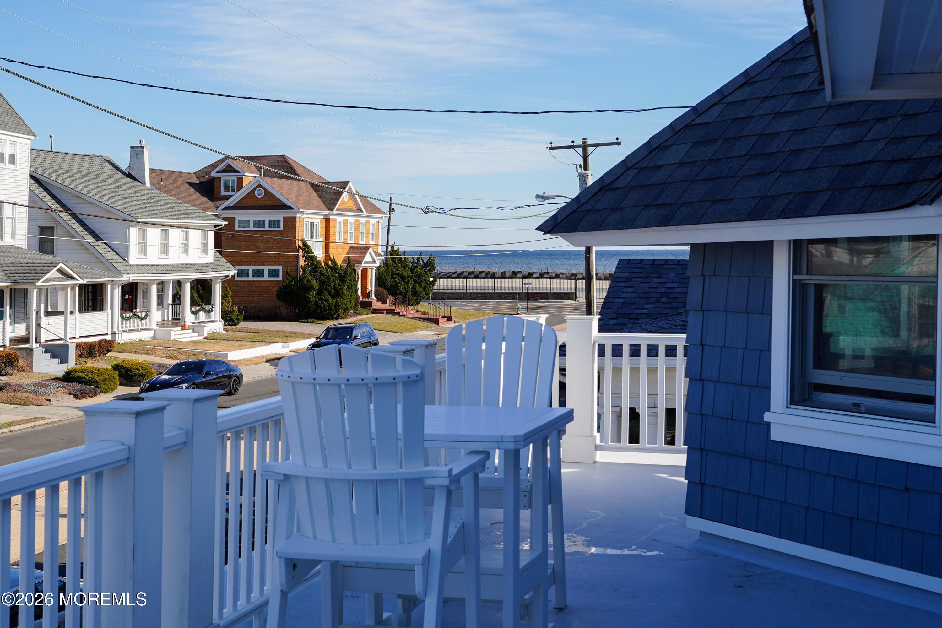 112 Euclid Avenue Allenhurst, NJ 07711 - Photo 29 of 52 a view of a house with wooden deck and furniture