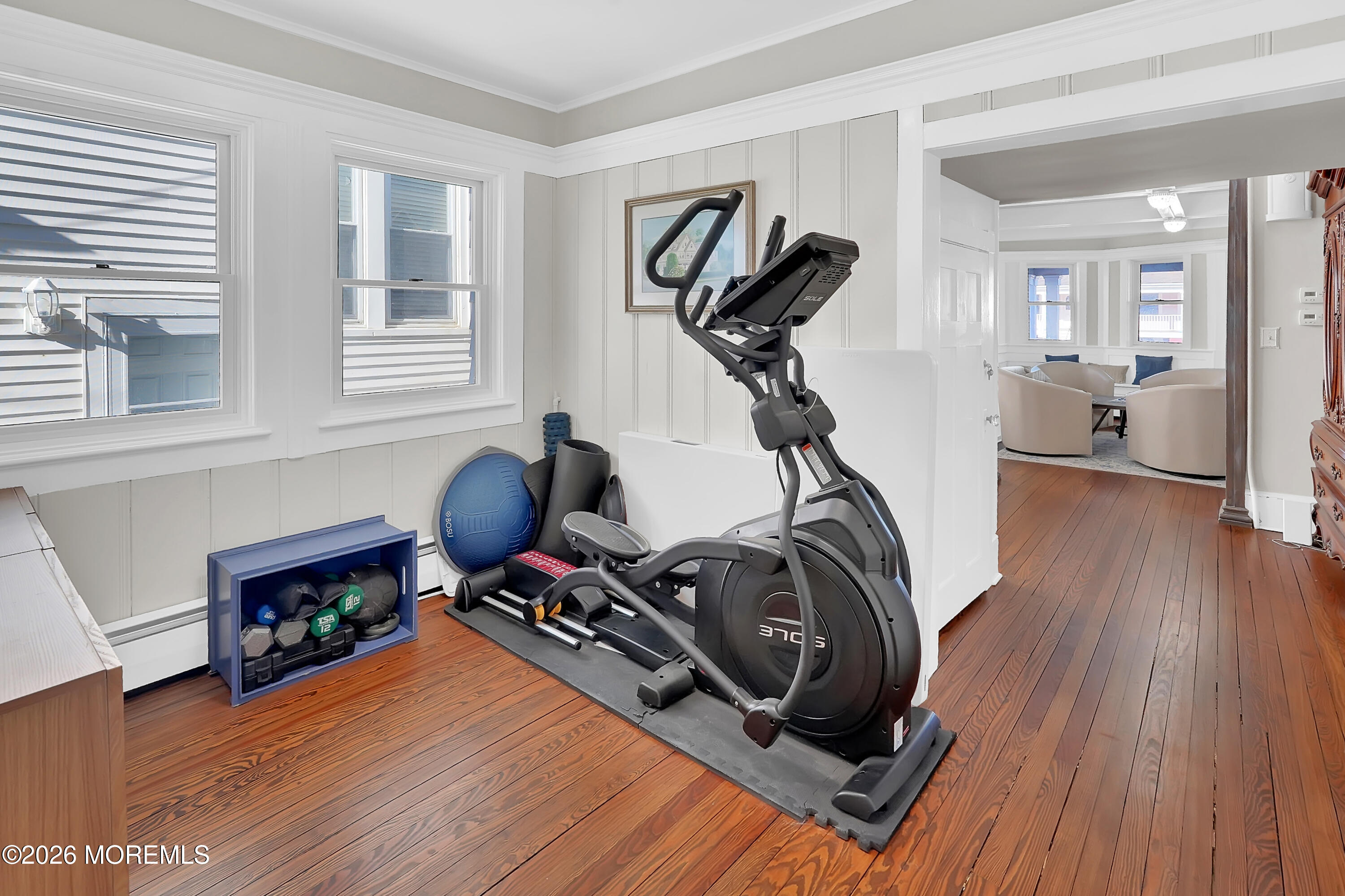 112 Euclid Avenue Allenhurst, NJ 07711 - Photo 40 of 52 a view of a livingroom with furniture and a gym cycle