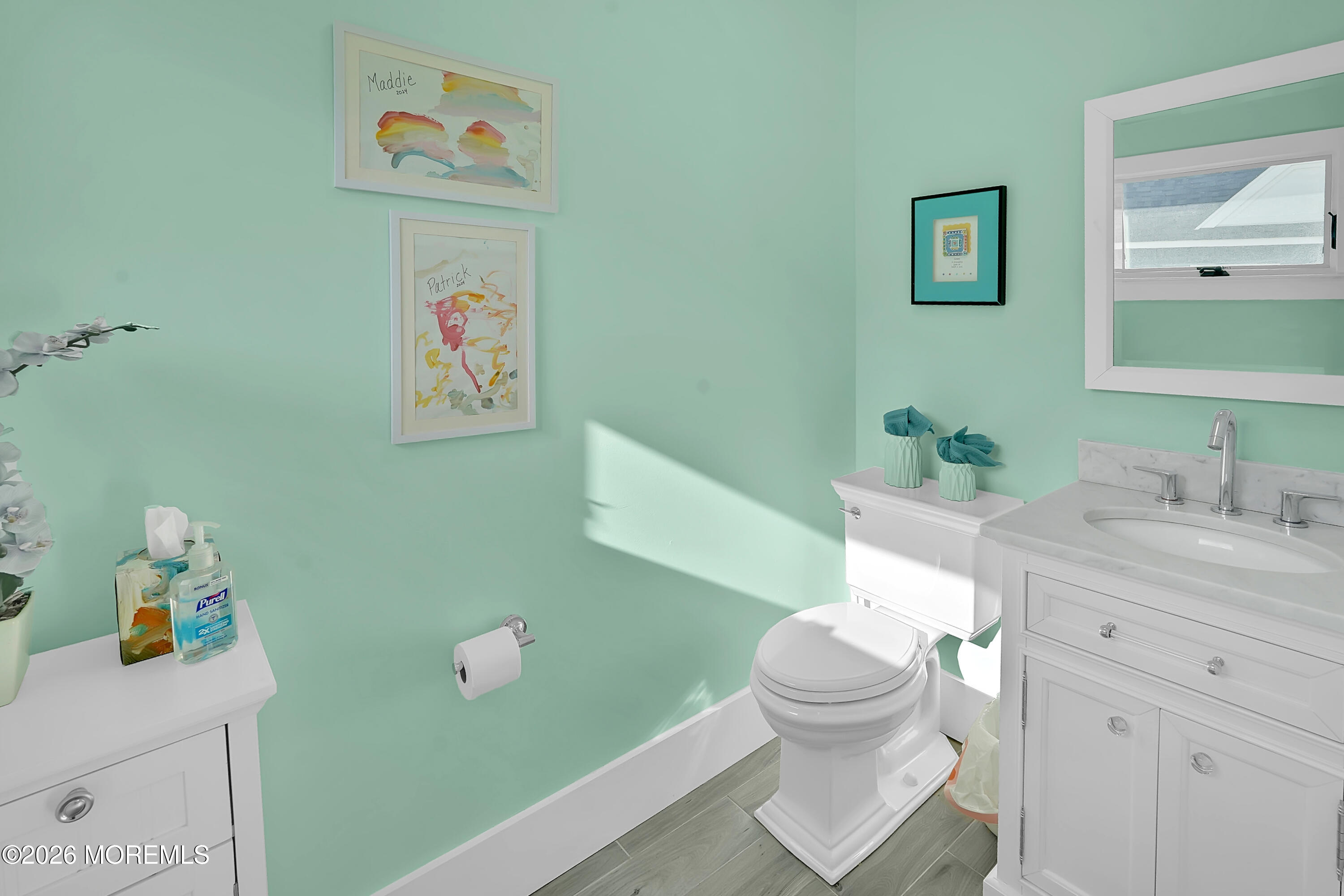 112 Euclid Avenue Allenhurst, NJ 07711 - Photo 41 of 52 a bathroom with a sink toilet and a mirror