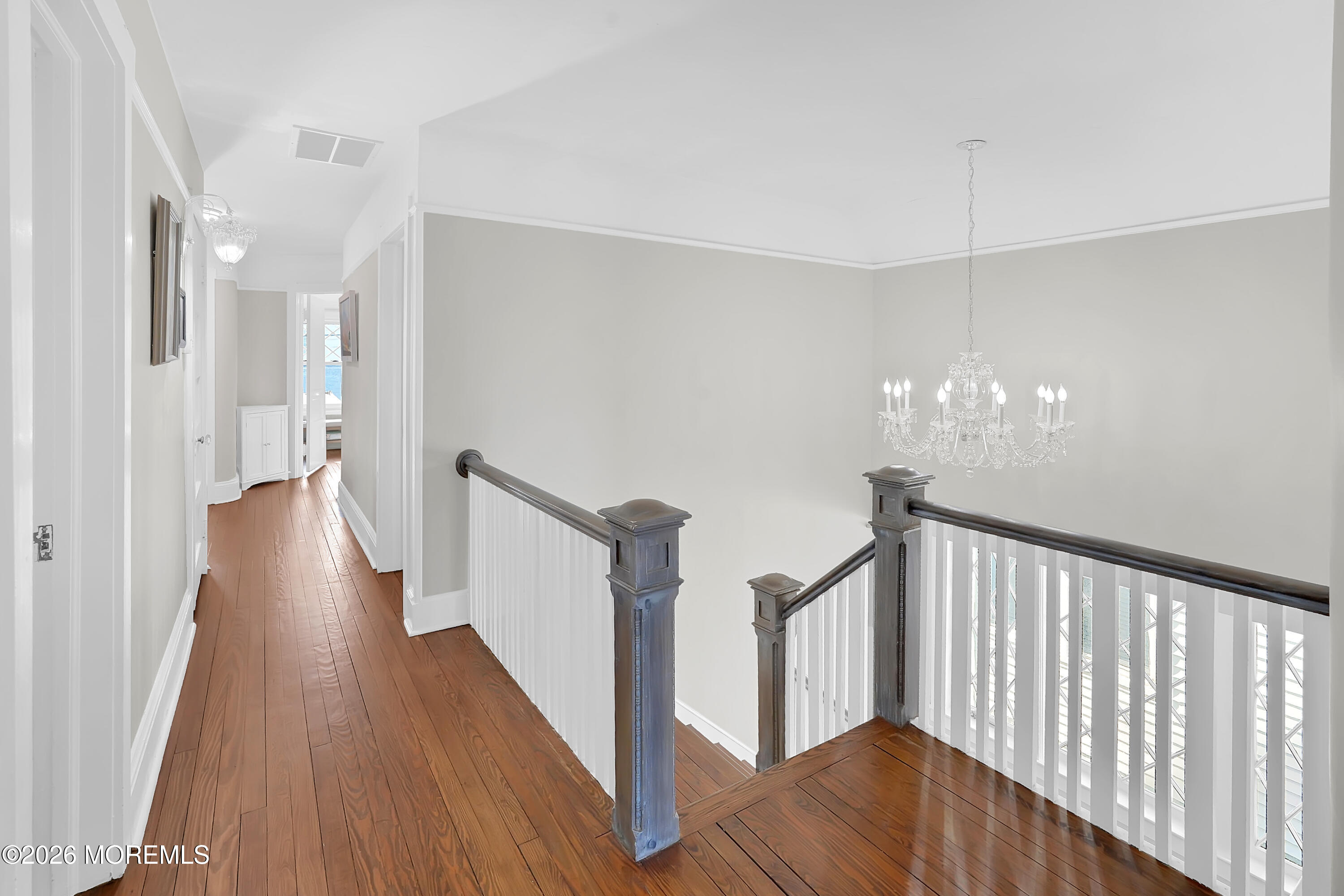 112 Euclid Avenue Allenhurst, NJ 07711 - Photo 44 of 52 a view of a hallway with wooden floor and staircase
