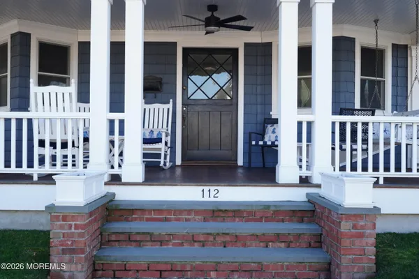 a view of a chairs and table in wooden floor