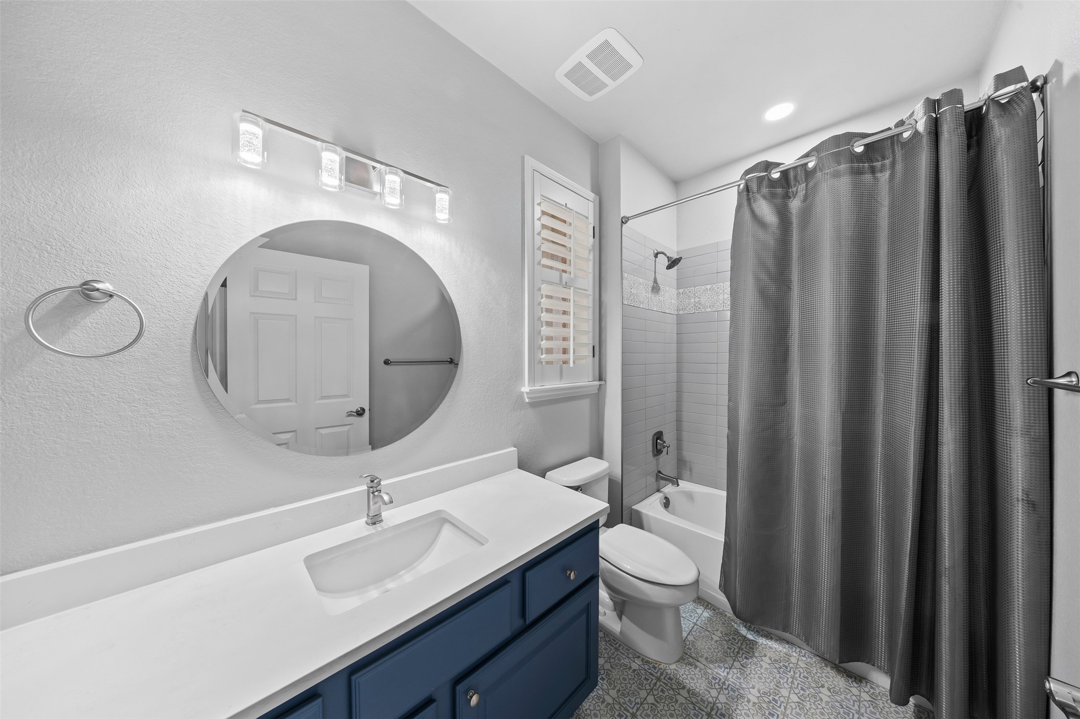 144 Stetson Trail Georgetown, TX 78633 - Photo 22 of 39 Bathroom featuring vanity, shower / bath combination, and granite tiled floors