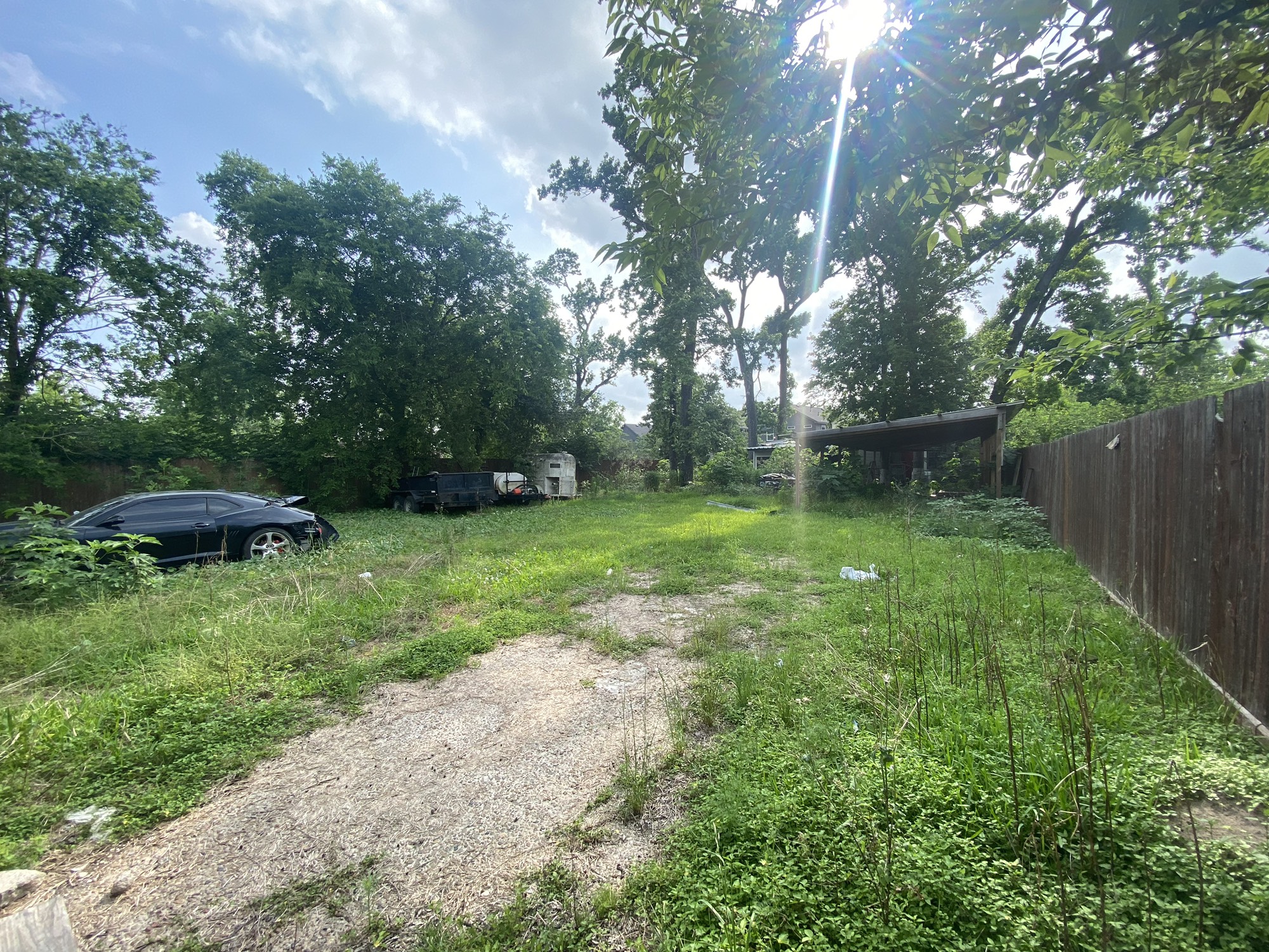9417 Pembrook Street Houston, TX 77016 - Photo 2 of 4 a view of a backyard with a garden