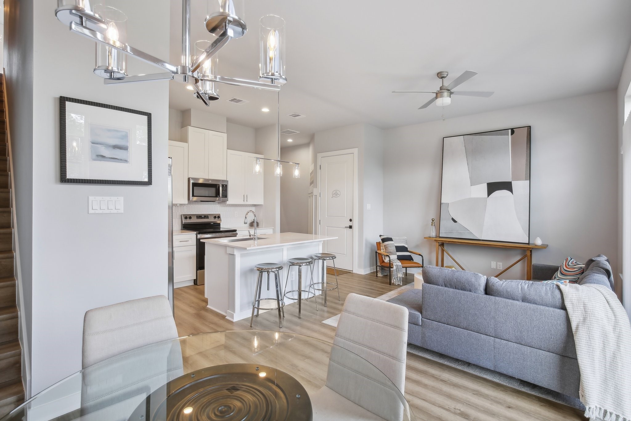 5779 Spring Stuebner Road Spring, TX 77388 - Photo 2 of 12 a living room with furniture kitchen and a chandelier