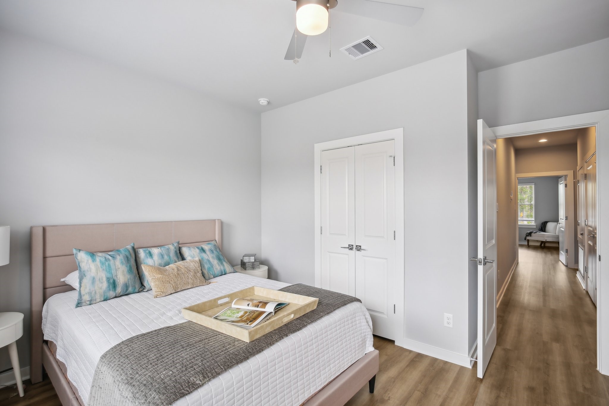 5779 Spring Stuebner Road Spring, TX 77388 - Photo 7 of 12 a bedroom with a bed and a chandelier