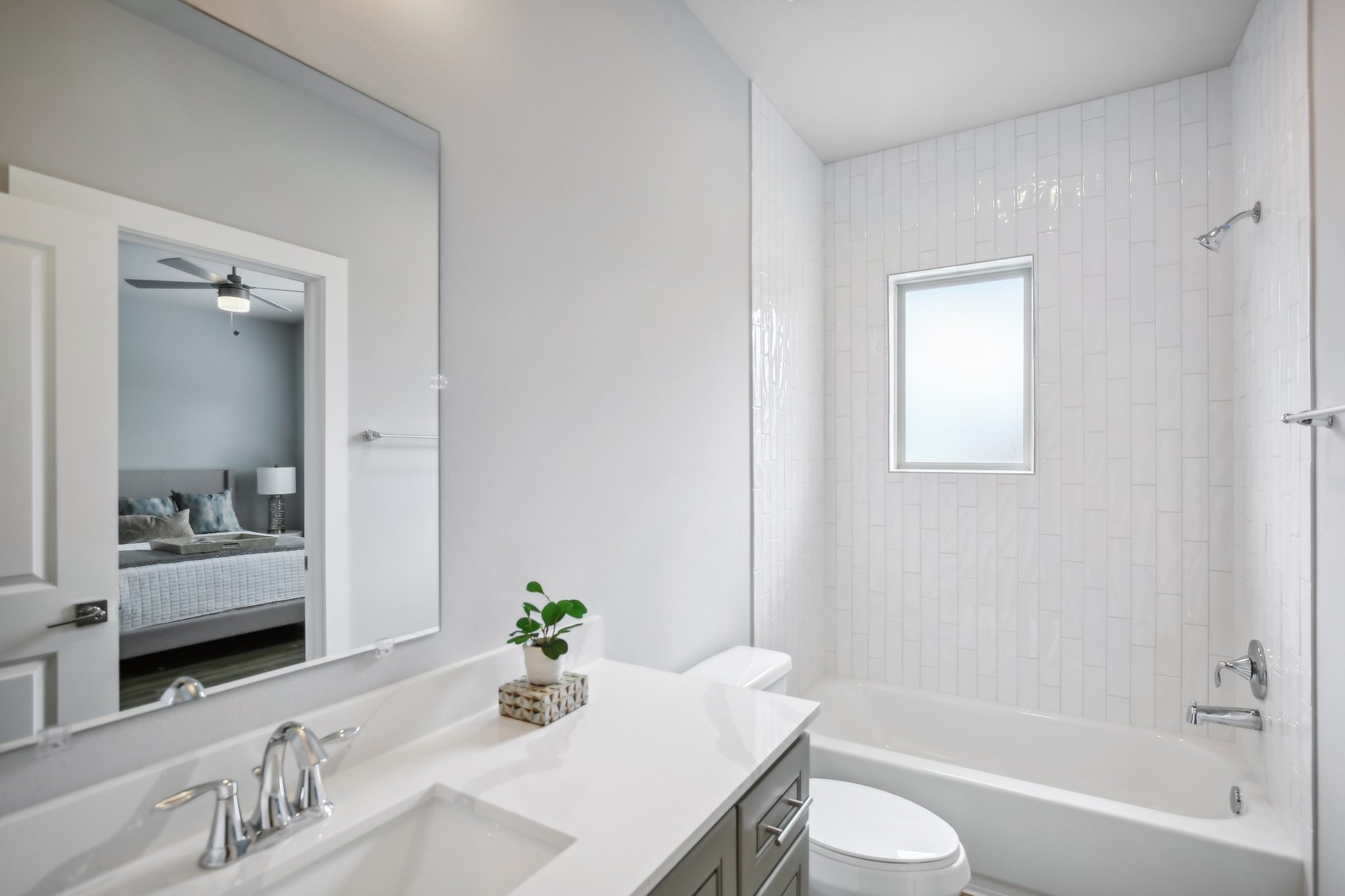 5779 Spring Stuebner Road Spring, TX 77388 - Photo 9 of 12 a bathroom with a granite countertop sink a toilet and shower