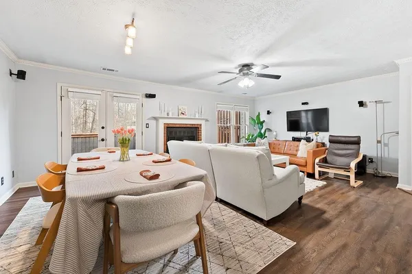 a living room with fireplace furniture and a flat screen tv