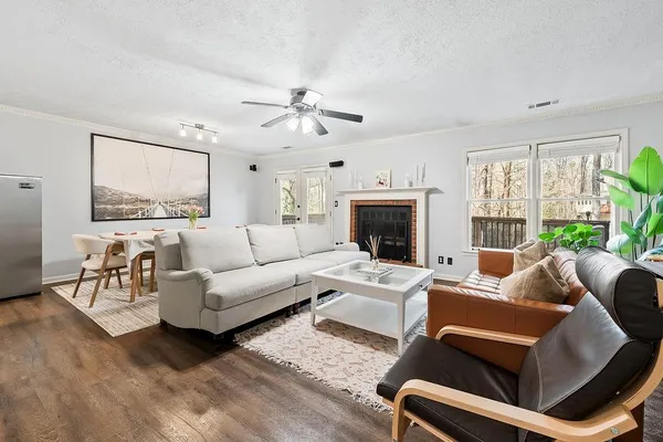 a living room with furniture and a fireplace