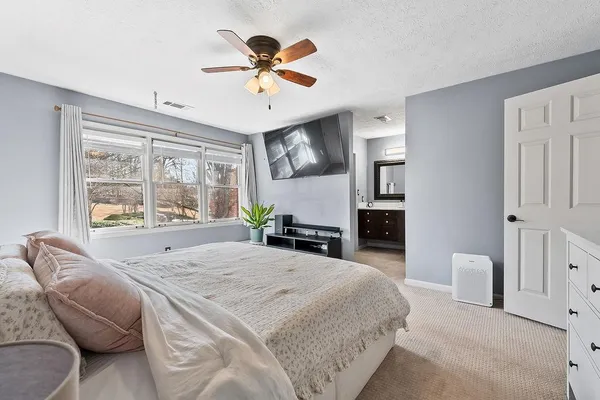a bathroom with a double vanity sink and mirror