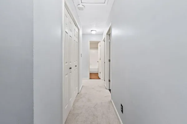 a bedroom with furniture and a wooden floor