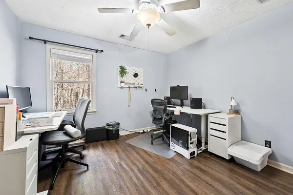a view of a workspace with furniture and lounge chair