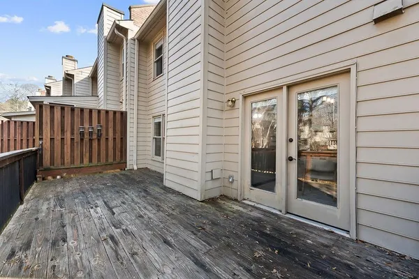 a view of small space with wooden fence