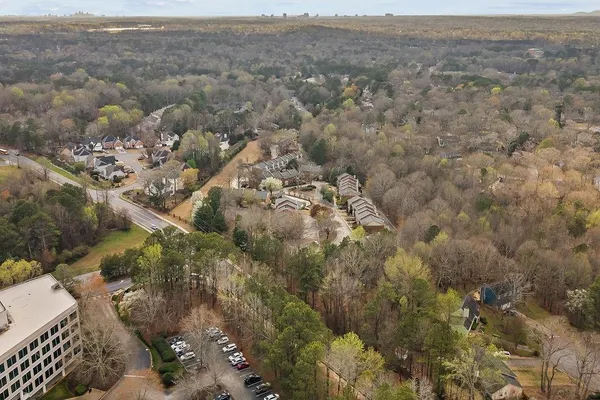 a view of a yard with cars parked