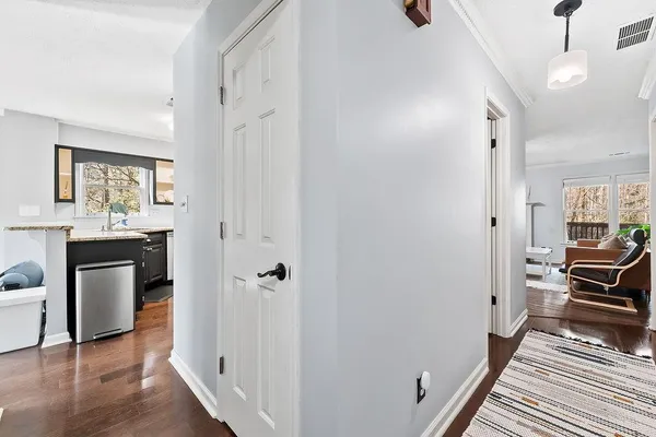 a view of a kitchen from the hallway