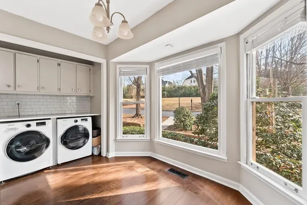 a view of a kitchen with washer and dryer