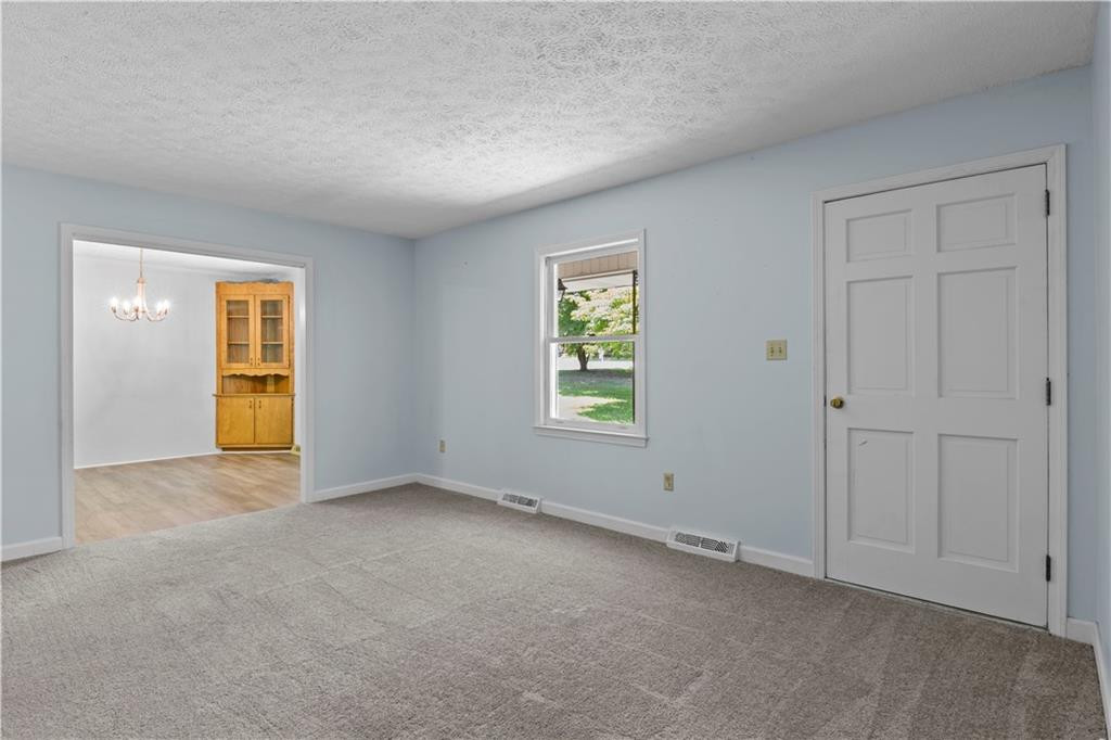 137 Roxdale Place Roxboro, NC 27574 - Photo 13 of 30 an empty room with windows and closet