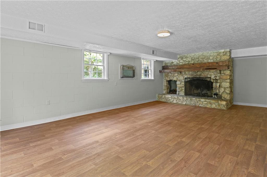 137 Roxdale Place Roxboro, NC 27574 - Photo 28 of 30 an empty room with windows and fireplace