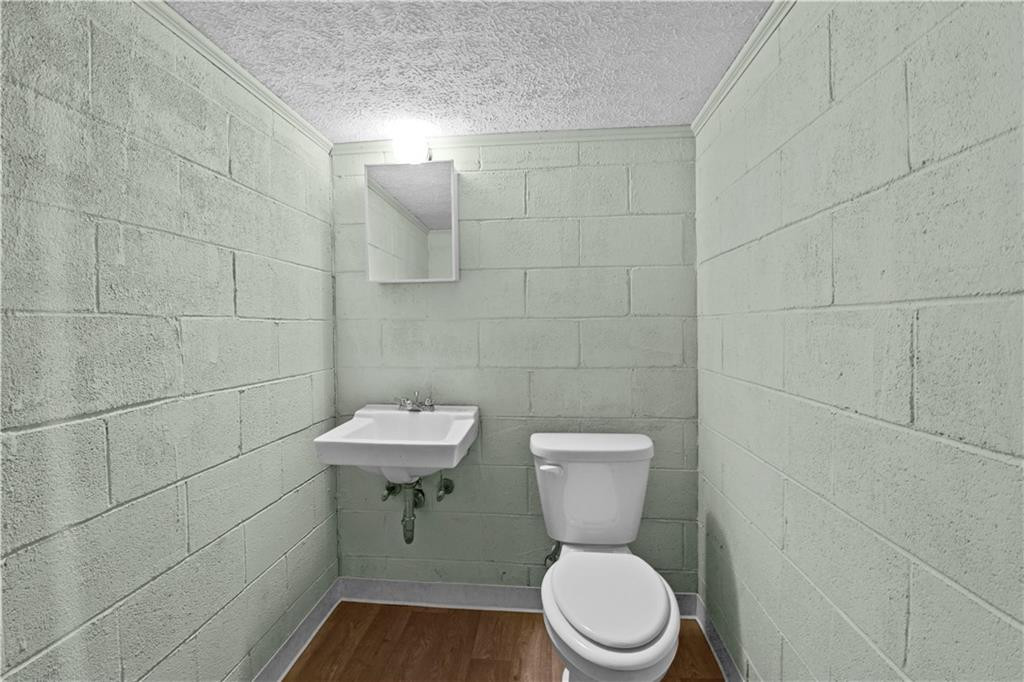 137 Roxdale Place Roxboro, NC 27574 - Photo 29 of 30 a white toilet sitting next to a bathroom sink