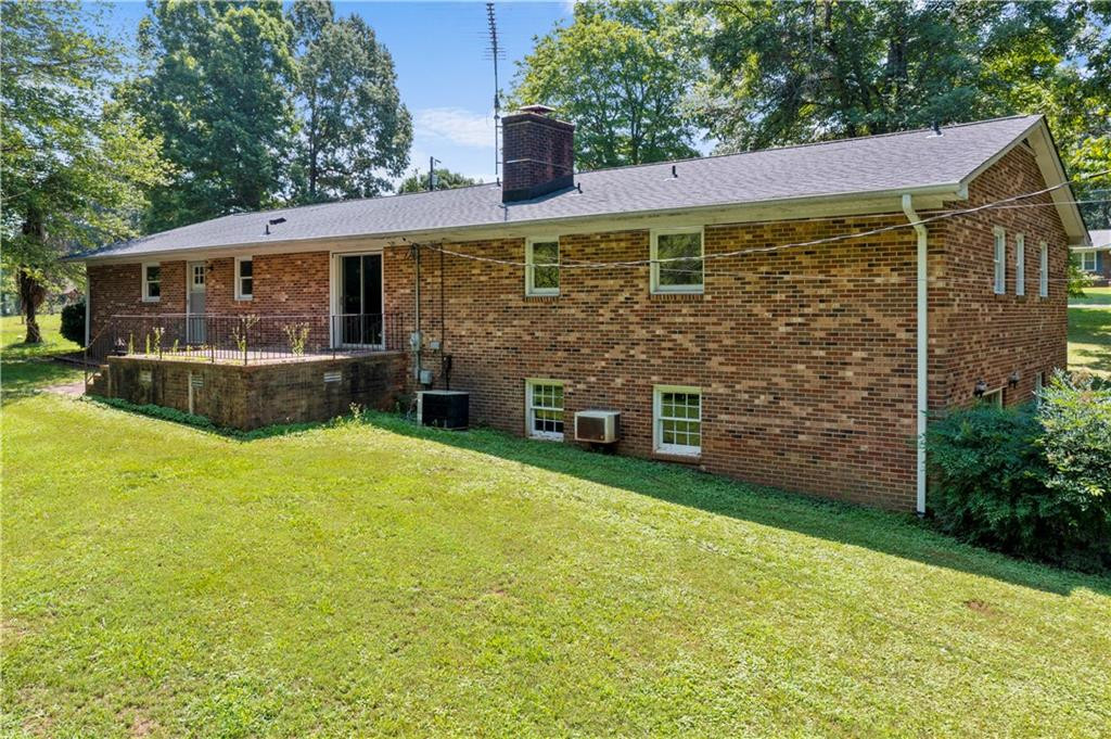 137 Roxdale Place Roxboro, NC 27574 - Photo 5 of 30 a front view of a house with yard